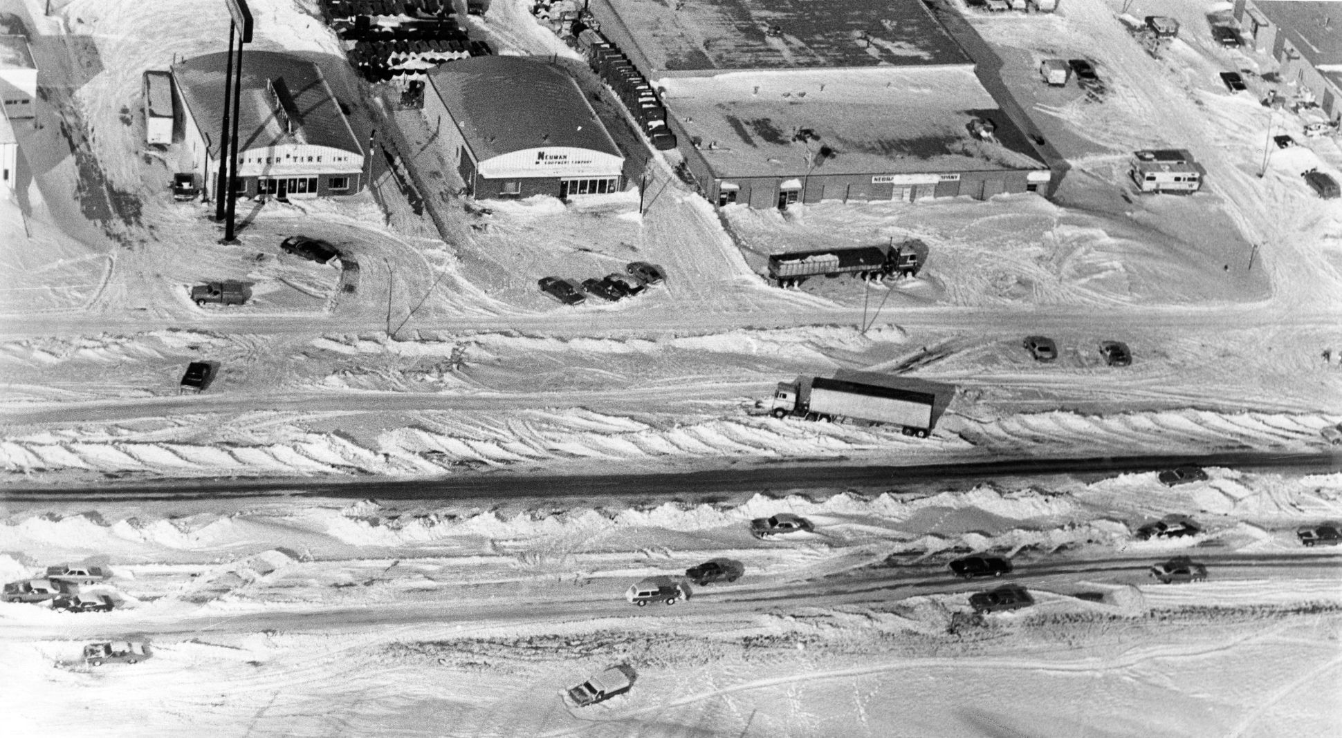 Abandoned cars and a truck are seen on L Street at 88th on Jan. 12, 1975.